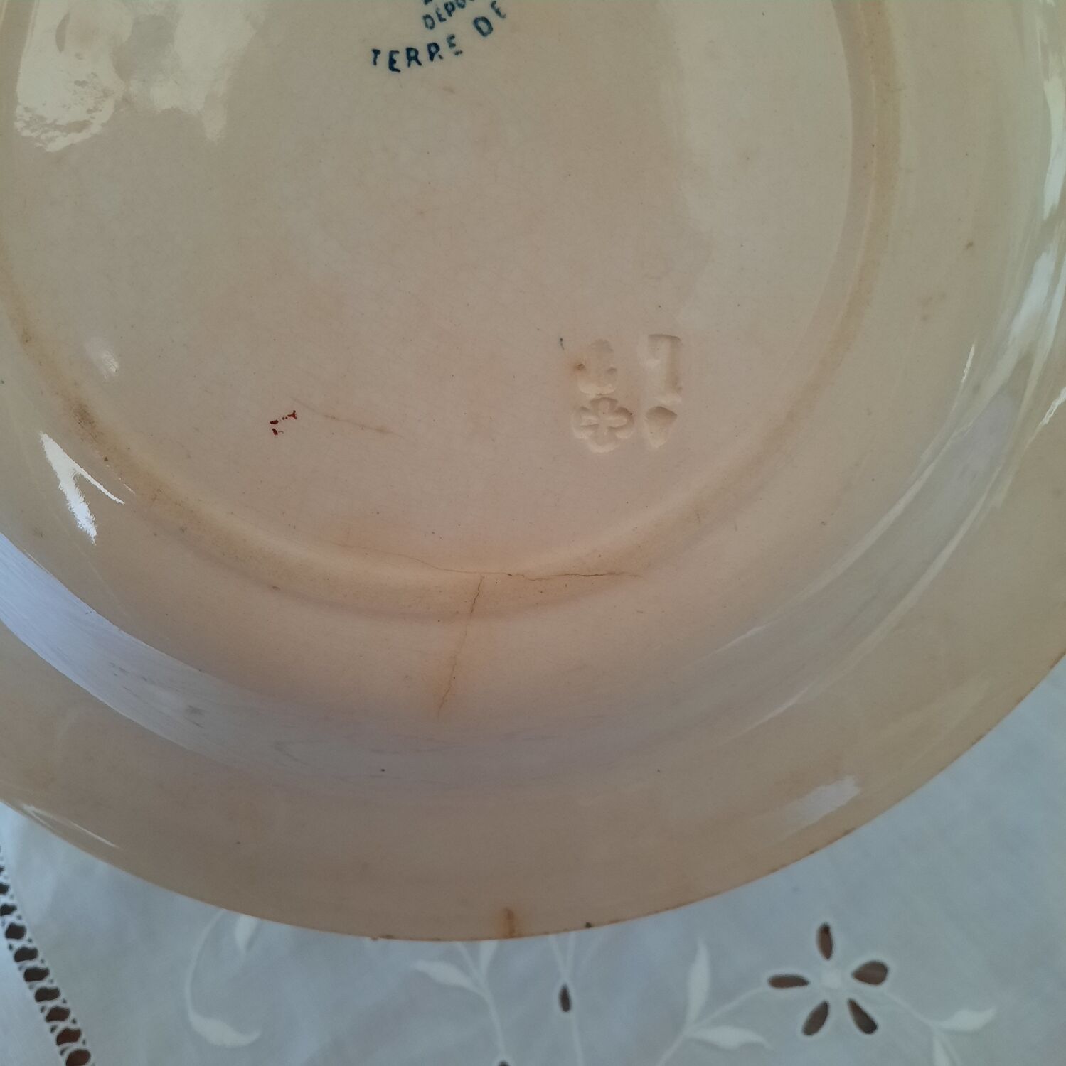 Old mismatched hollow plates in iron earth earthenware