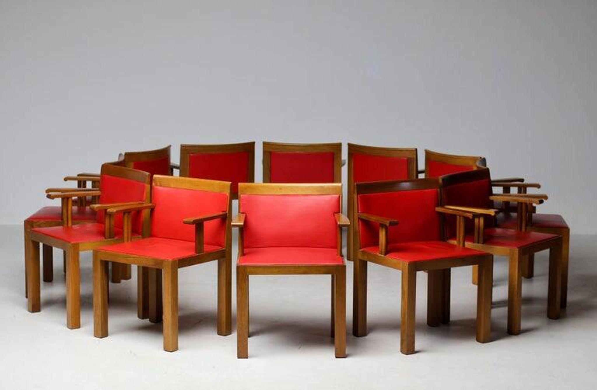 A masterpiece of Italian modernism: eleven Aldo Rossi red Teatro arm chairs