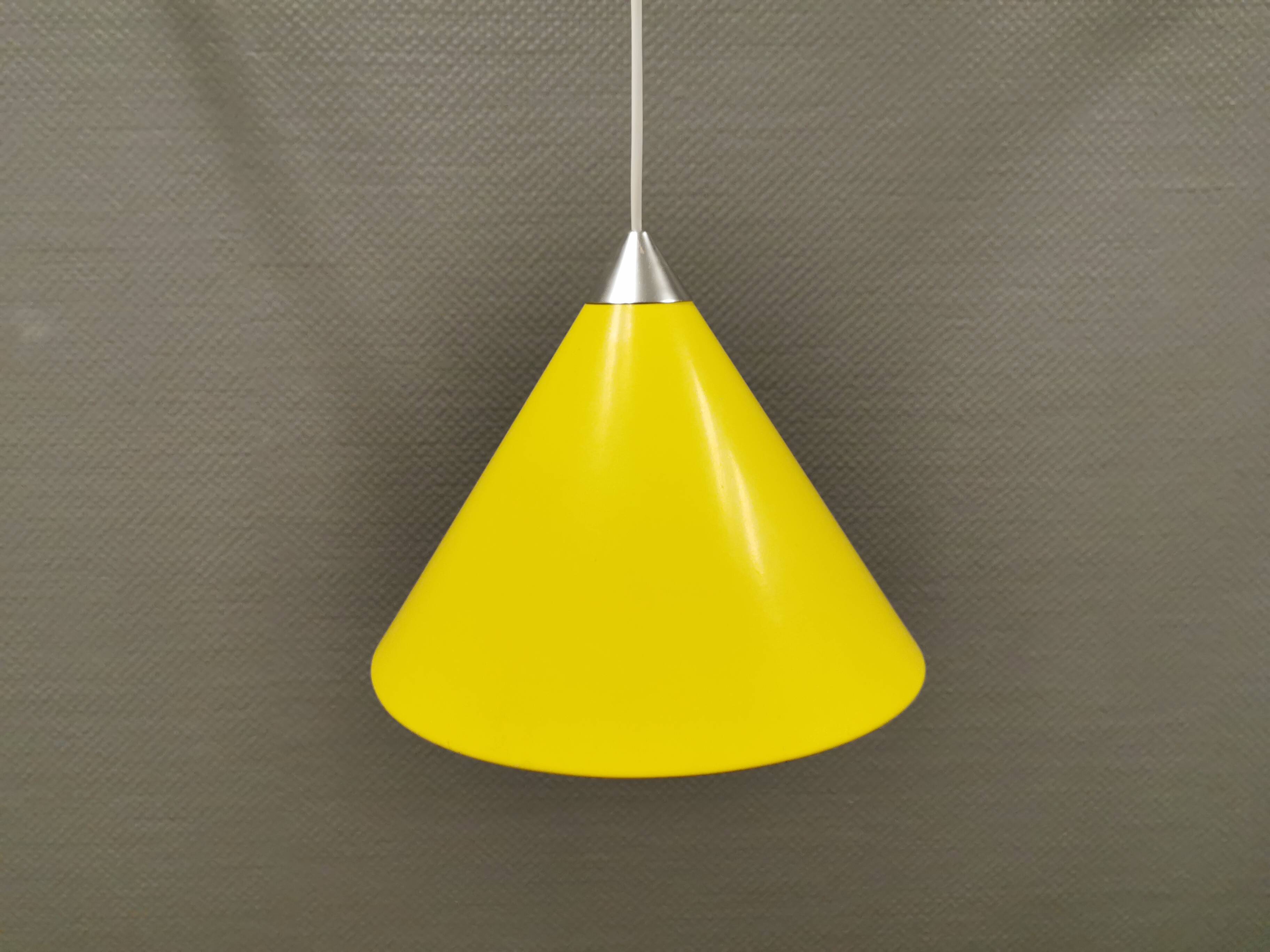 Small cone-shaped lamp in beautiful yellow lacquer finish.