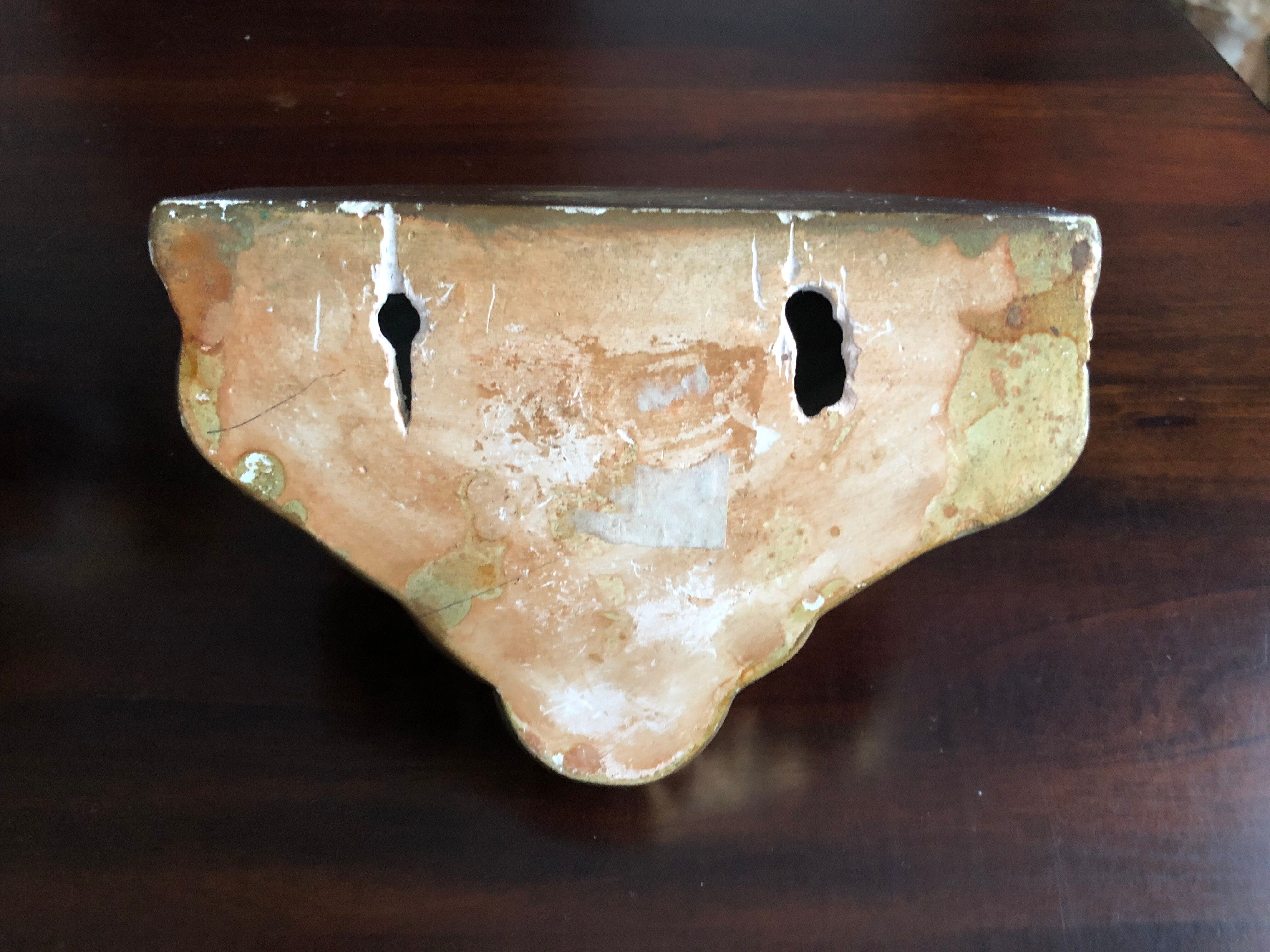 Wall console in gilded plaster