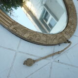 Miroir biseauté art déco en bois et stuc doré 66x39cm