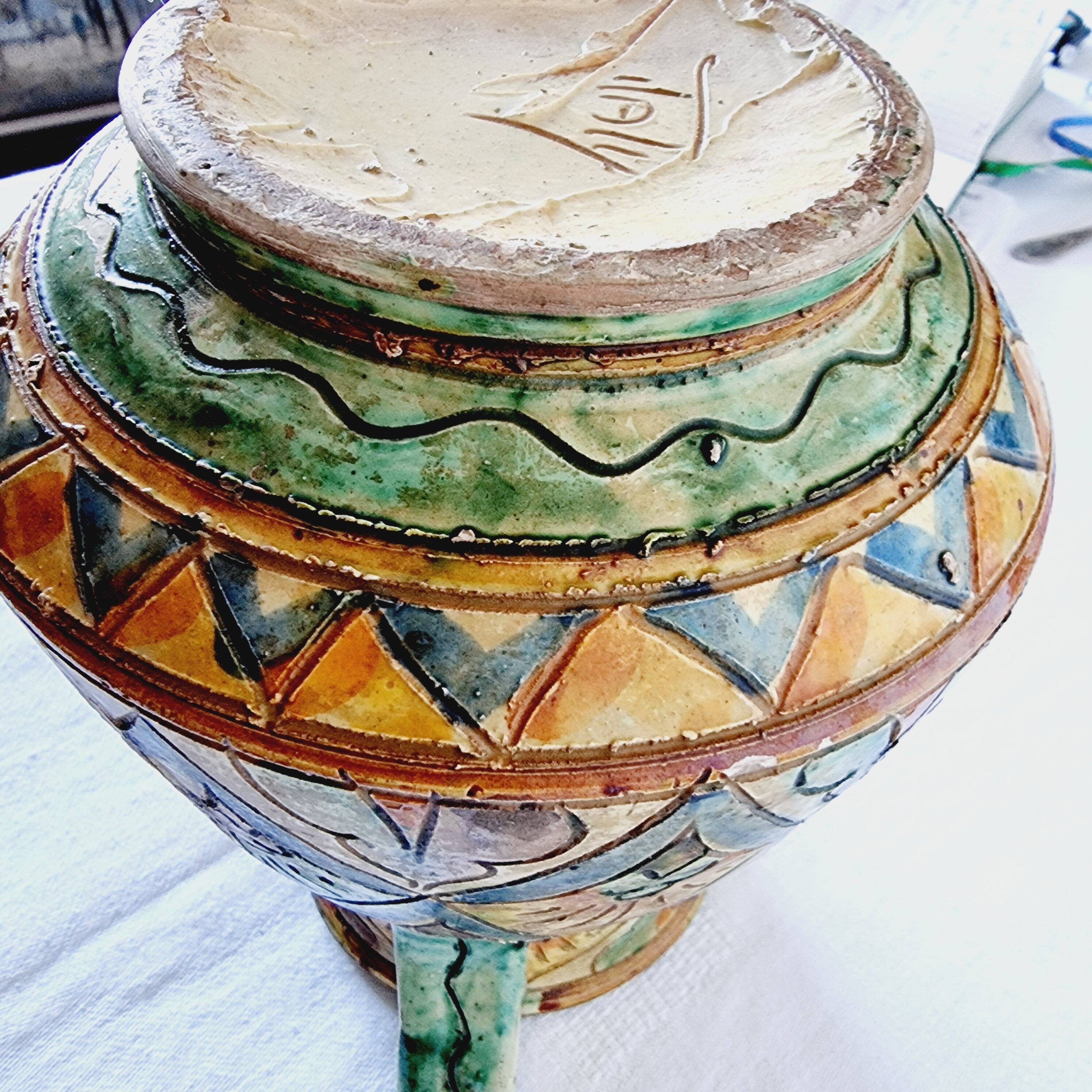 Antique majolica water pitcher made in Italy and hand painted.