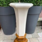 Column wears vintage plant