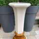Column wears vintage plant