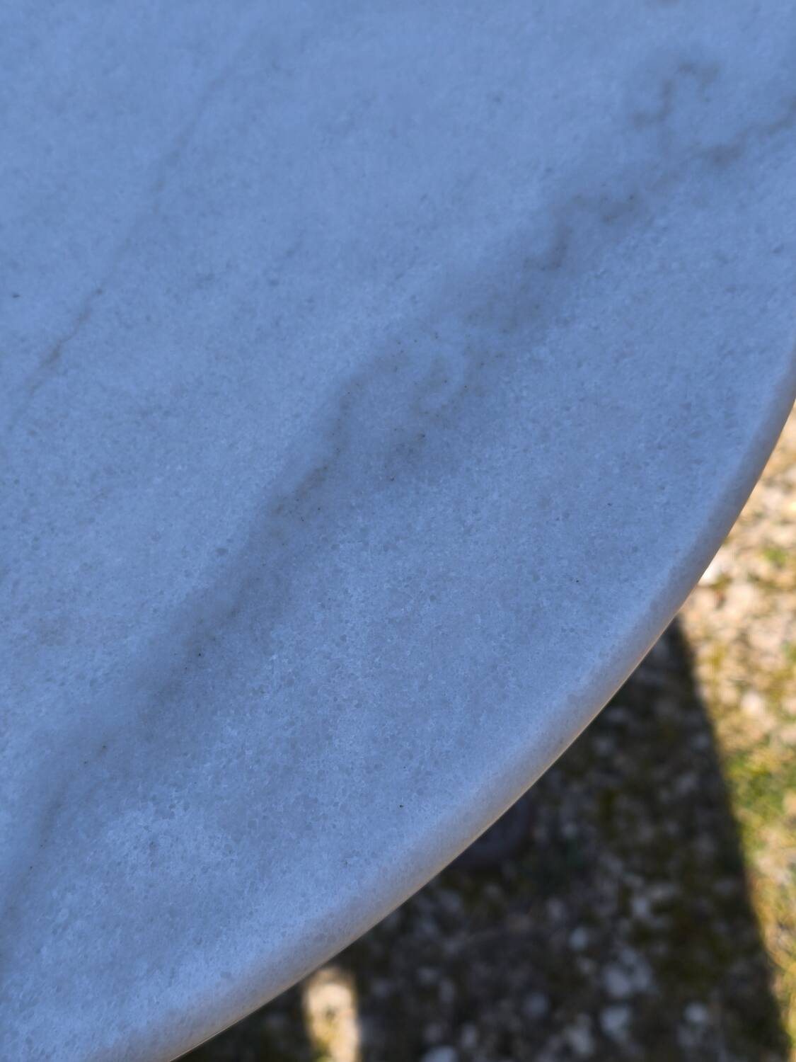 Marble bistro table with cast iron legs in Parisian café style