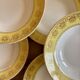 Set of 12 vintage yellow, white and gold soup plates