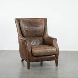 Very comfortable vintage cow leather armchair with character