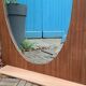 Miroir oval biseauté sur porte art déco Acajou 79x162