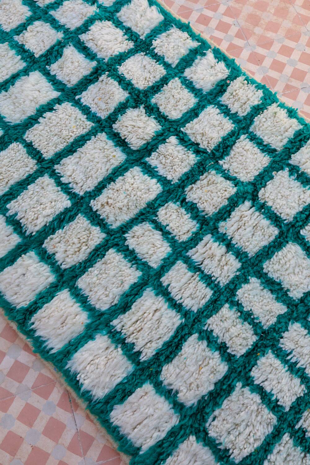 Moroccan hallway rug with inverted pine green and white checkerboard