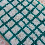 Moroccan hallway rug with inverted pine green and white checkerboard