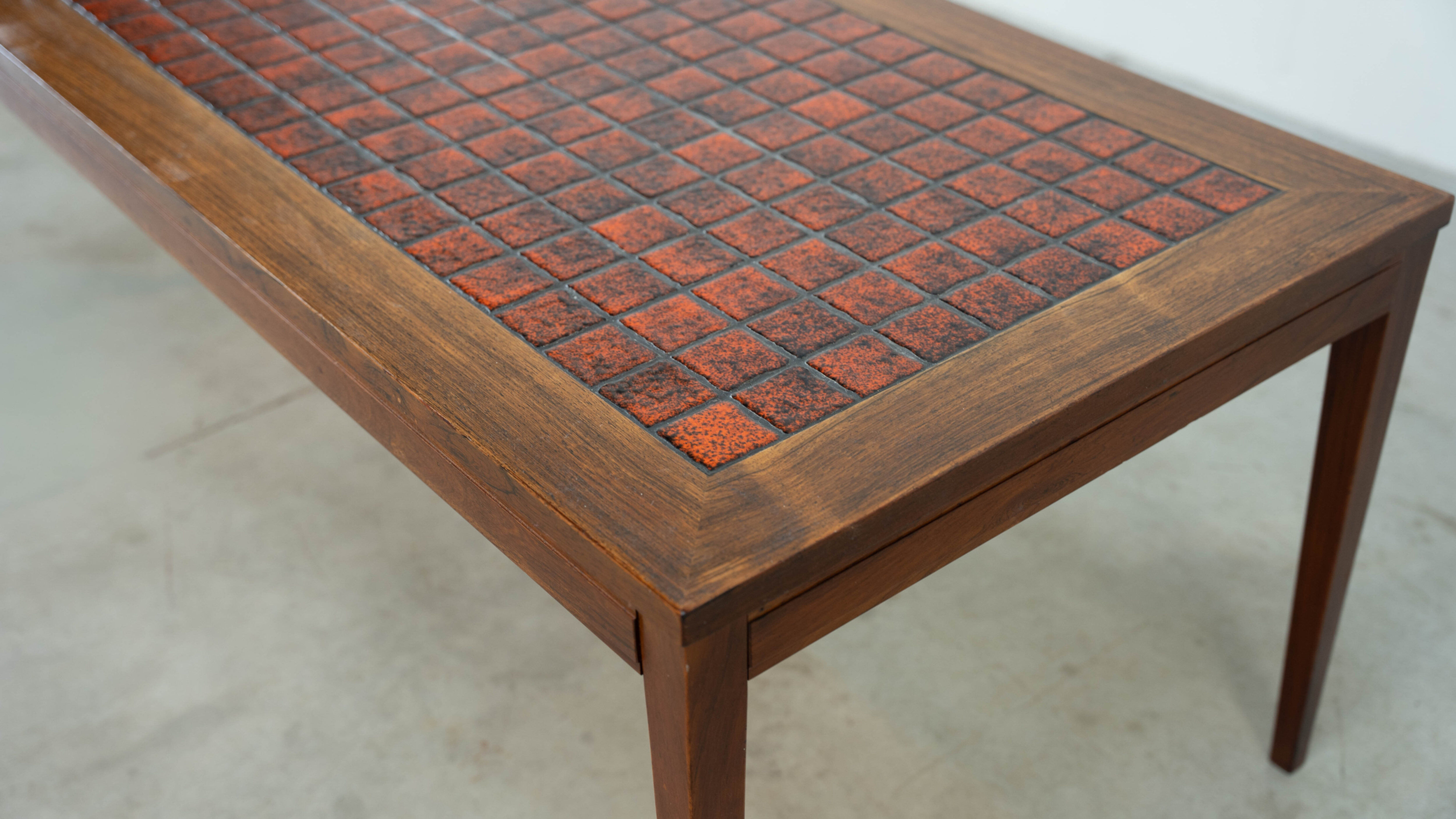 Danish red ceramic and teak coffee table