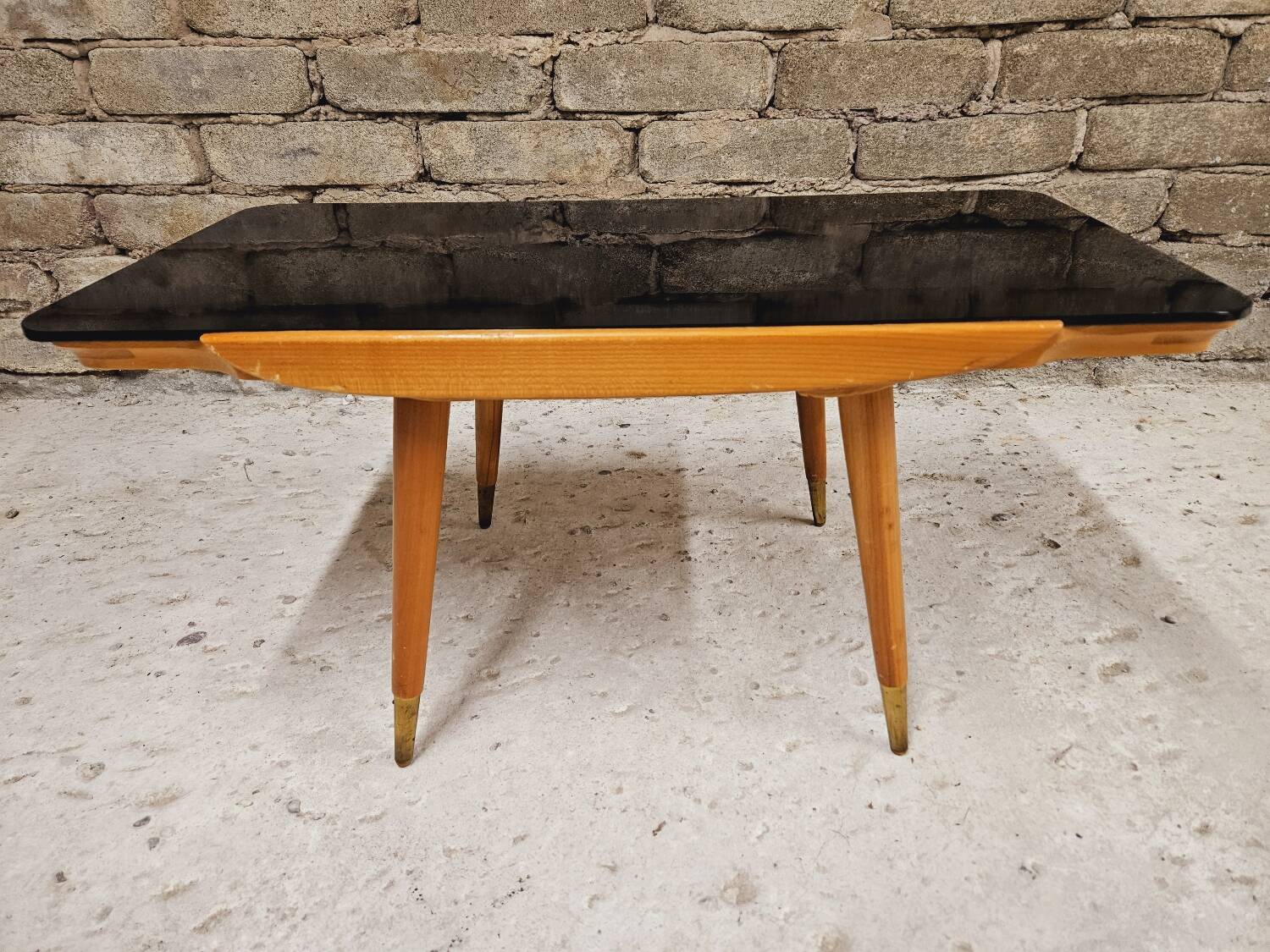 Small opaque black glass coffee table 1960