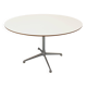 Vintage Eames round table for Vitra in white melamine, wood, and metal.