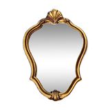 Old small wall mirror in golden resin