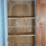 Rustic antique bonnetière in weathered blue-grey wood.