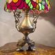 Antique bronze lamp and Tiffany-style stained glass shade. 46x32