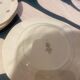 Dessert plate and porcelain dishes with a multicoloured floral pattern, vintage.