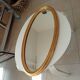 Miroir vintage ovale en bois doré années 60 77*41 cm