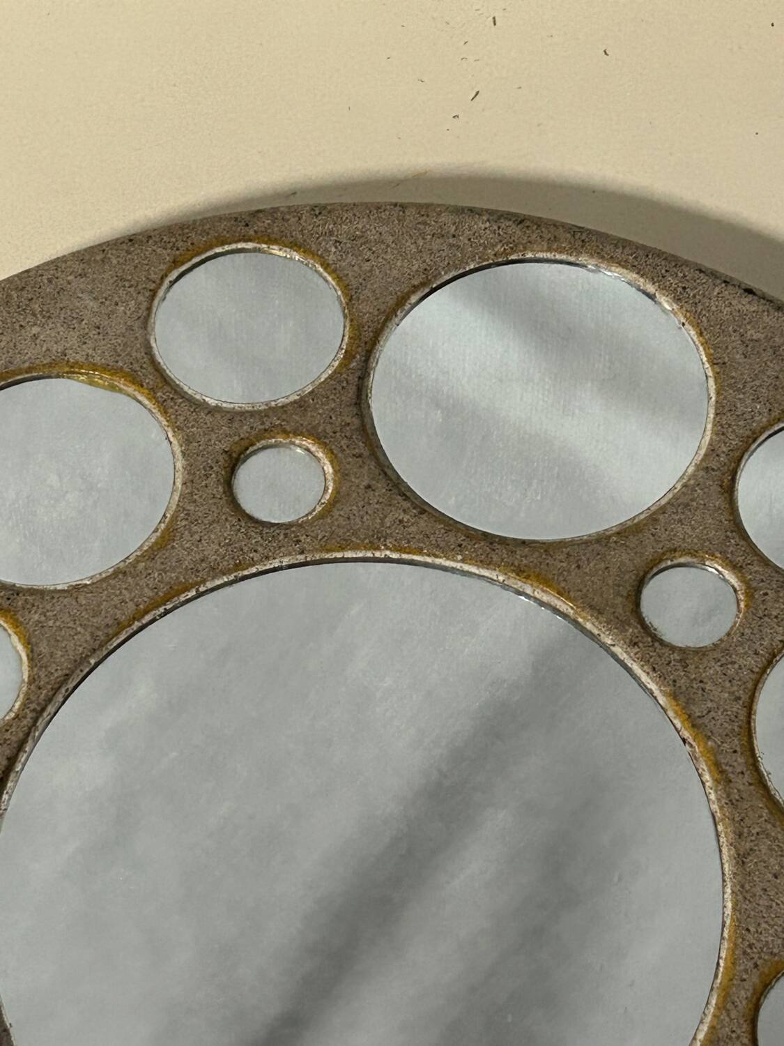 Round ceramic mirror