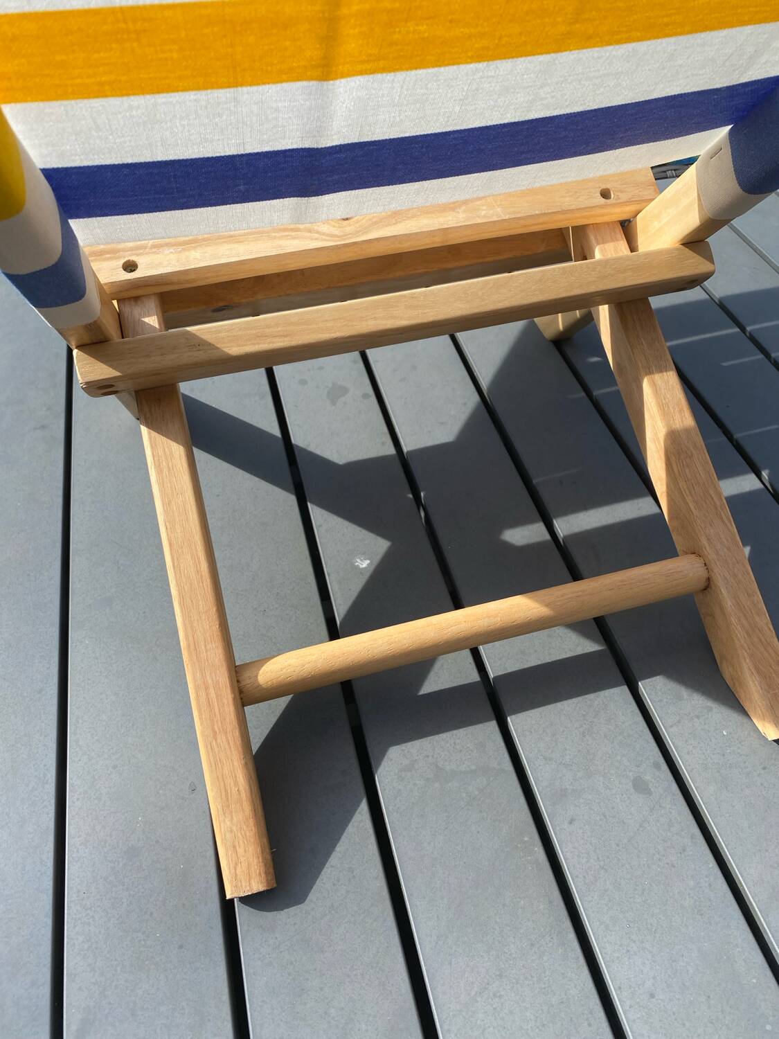 Folding chair in wood and striped fabric