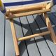 Folding chair in wood and striped fabric