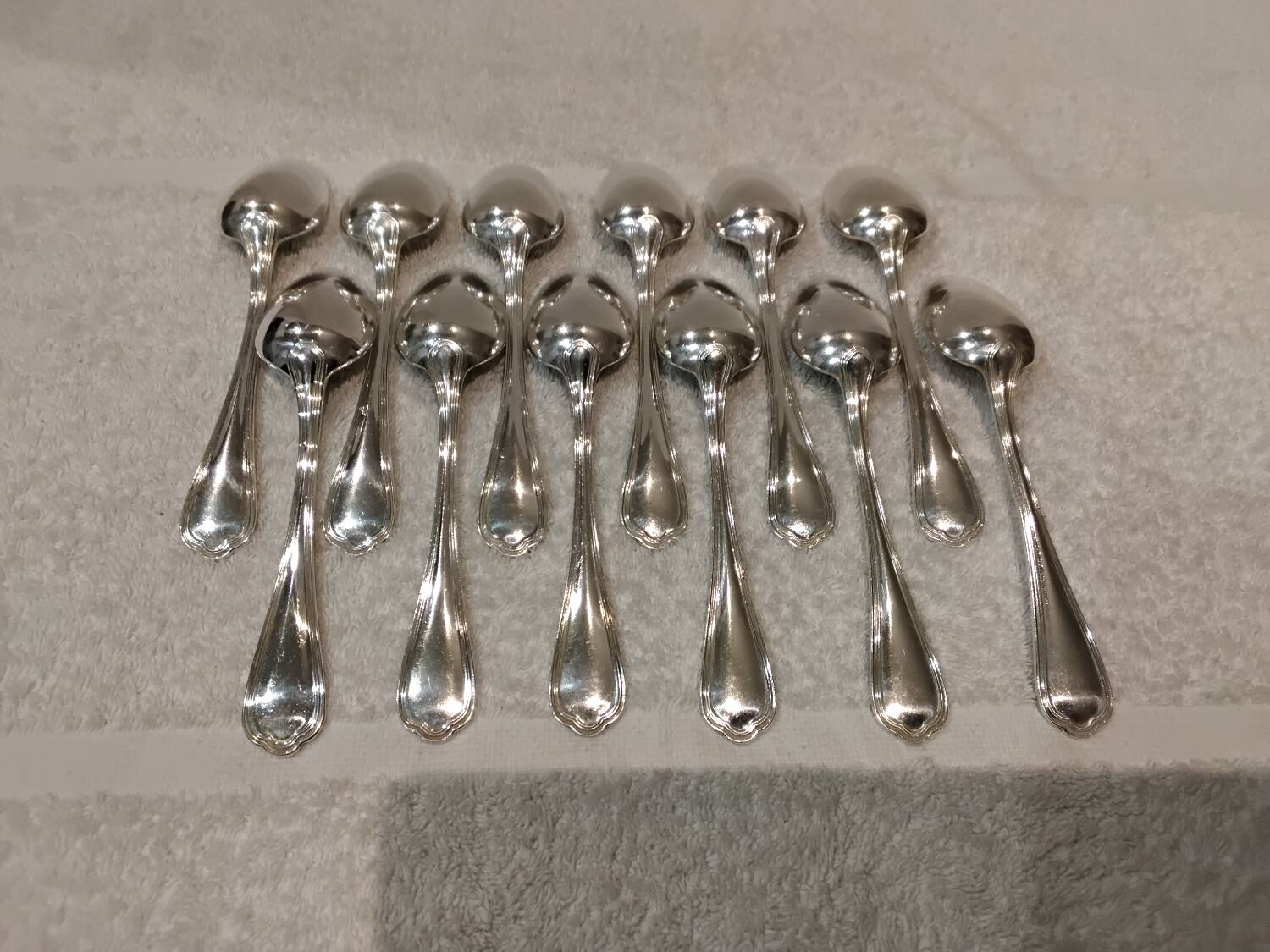 12 Christofle silver plated dessert spoons, 17cm