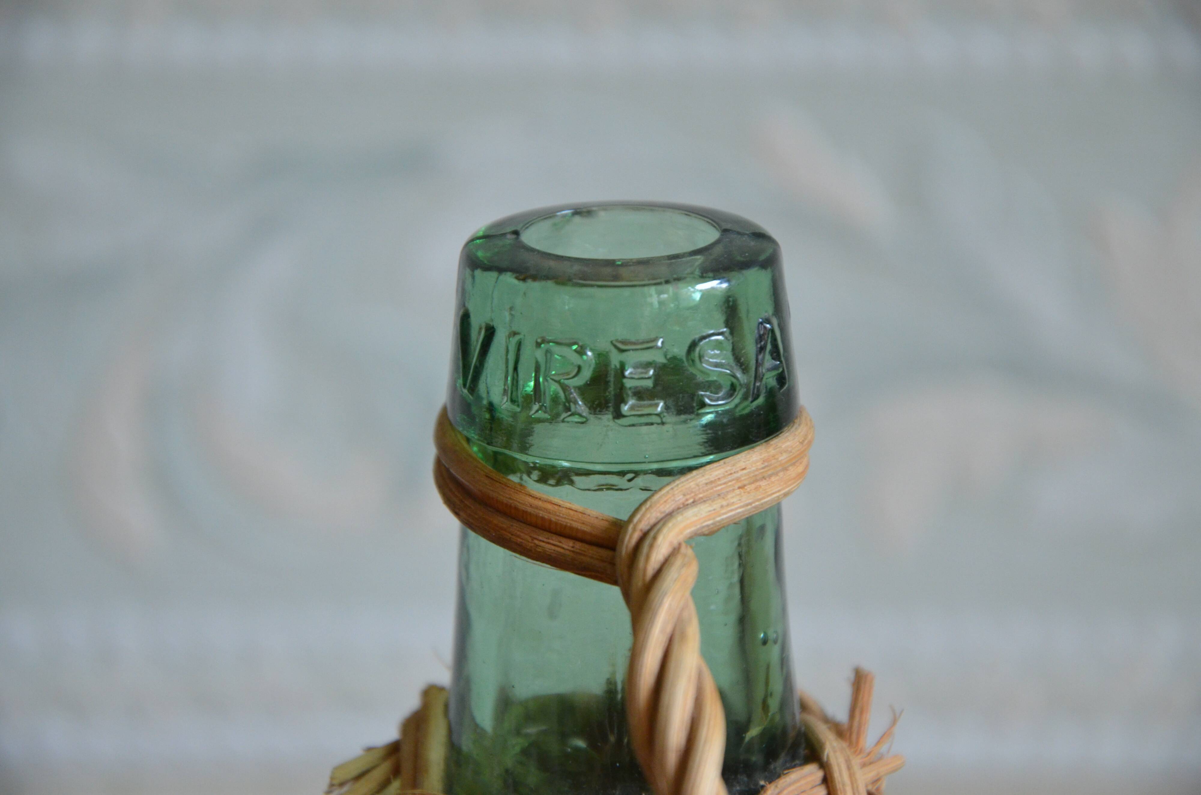 Viresa glass bottle and woven rattan