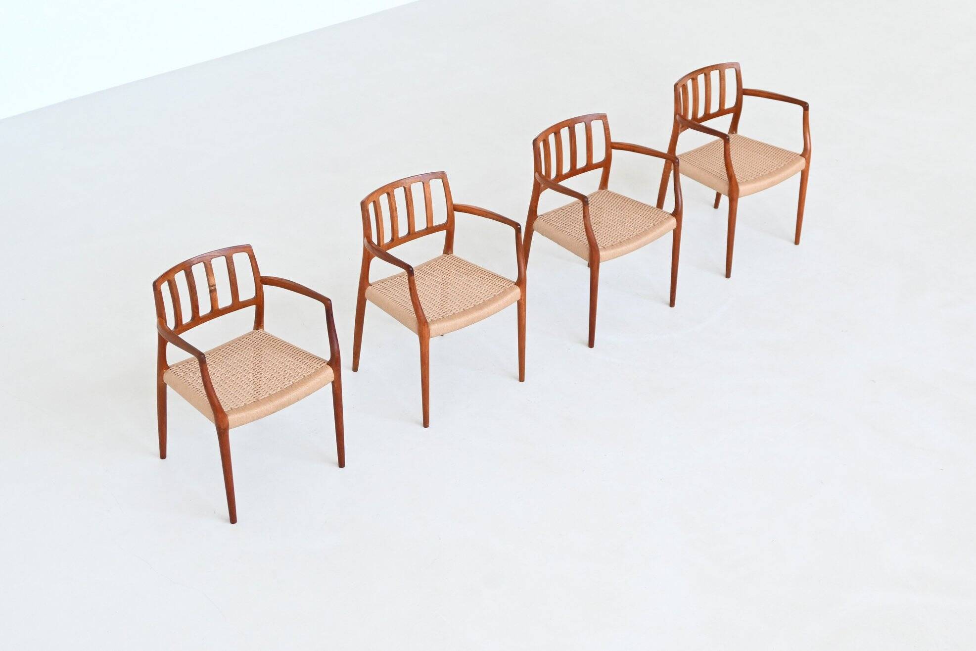 Niels Otto Moller model 66 armchairs teak and paper cord Denmark 1974