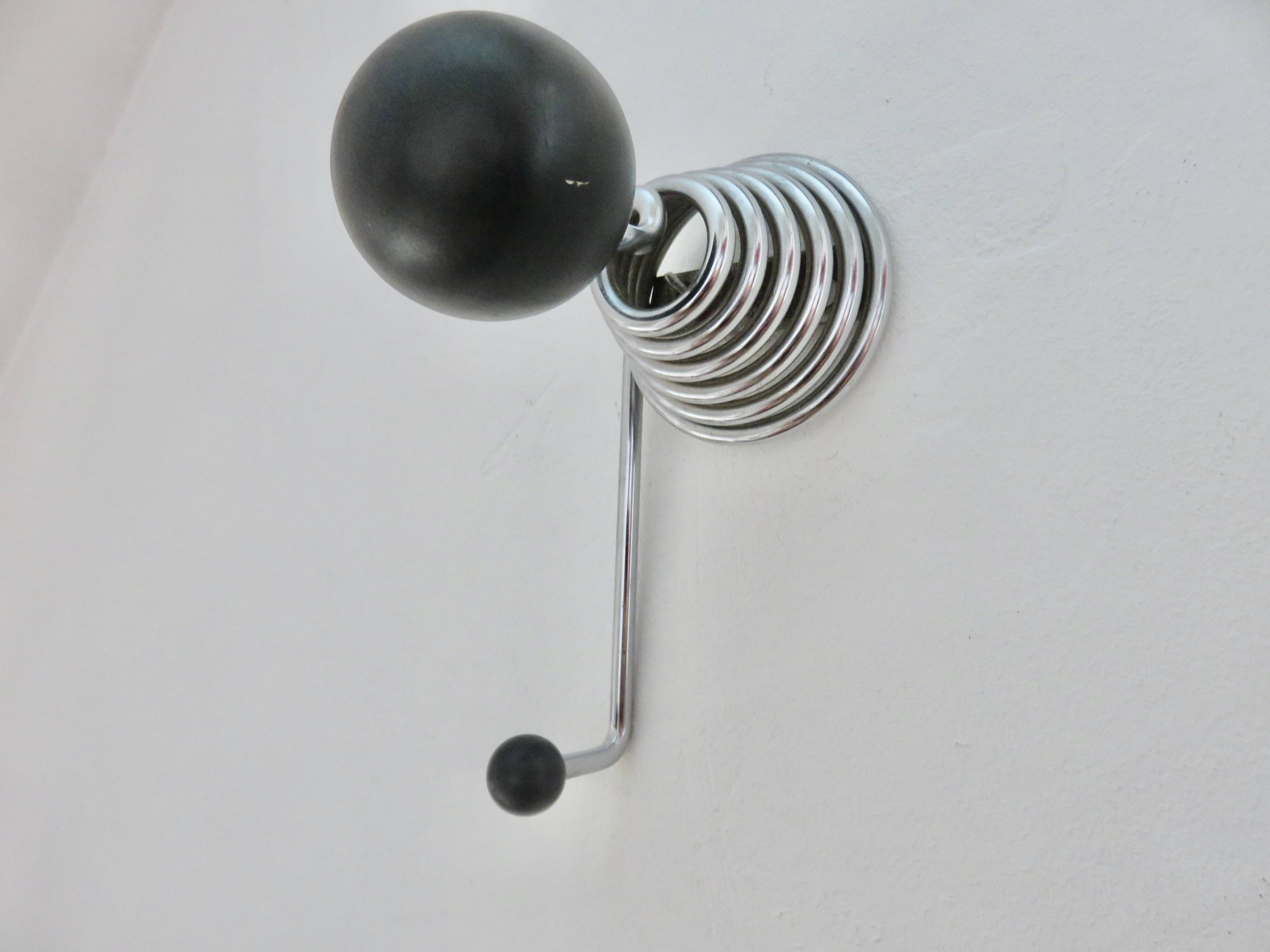 "Streamline" wall coat rack in chromed metal and black lacquered wood, 1970.