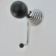 "Streamline" wall coat rack in chromed metal and black lacquered wood, 1970.