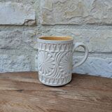 Old terracotta mug with glazed interior
