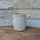 Old terracotta mug with glazed interior