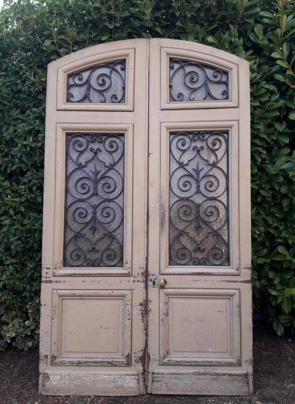 19th century double arched entrance door in oak with grilles and old glass