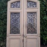 Porte d'entrée cintrée double en chêne, grilles et verre, XIXème