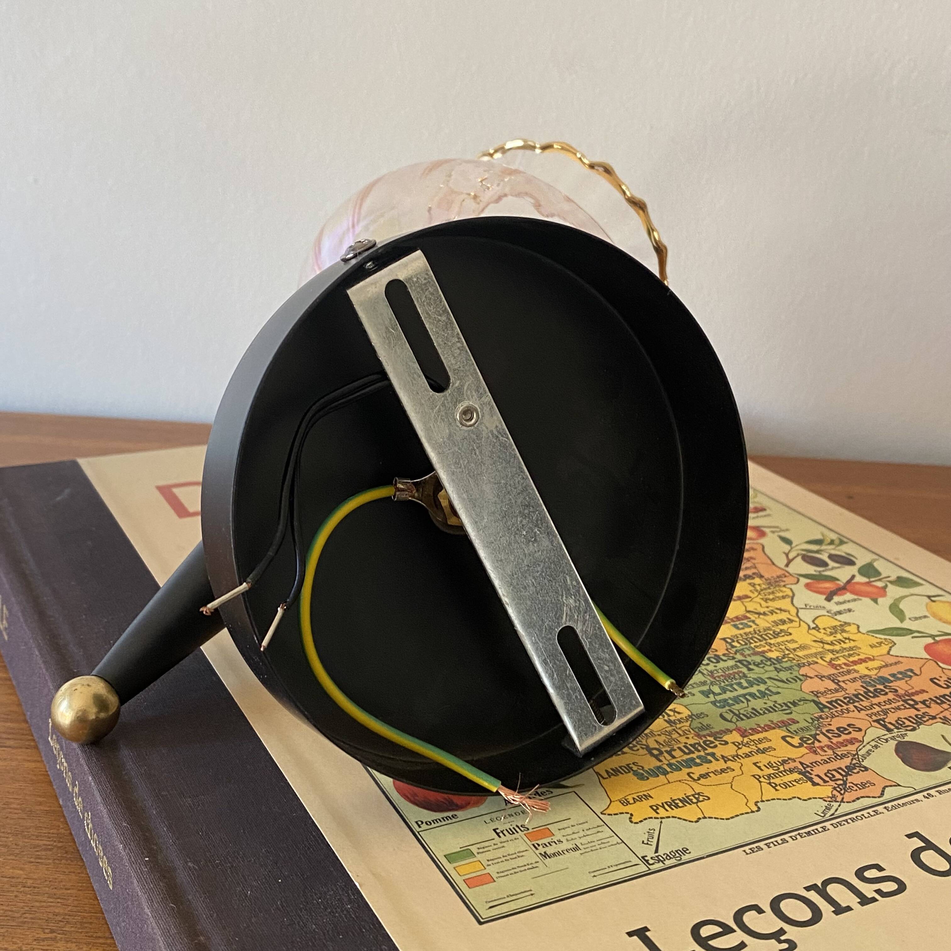 Pair of torch wall lights with iridescent pink glass shades and gold trim.