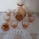 Pink glass liqueur carafe and 6 matching glasses