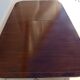 Mahogany top table inlaid with light wood nets and brass toes