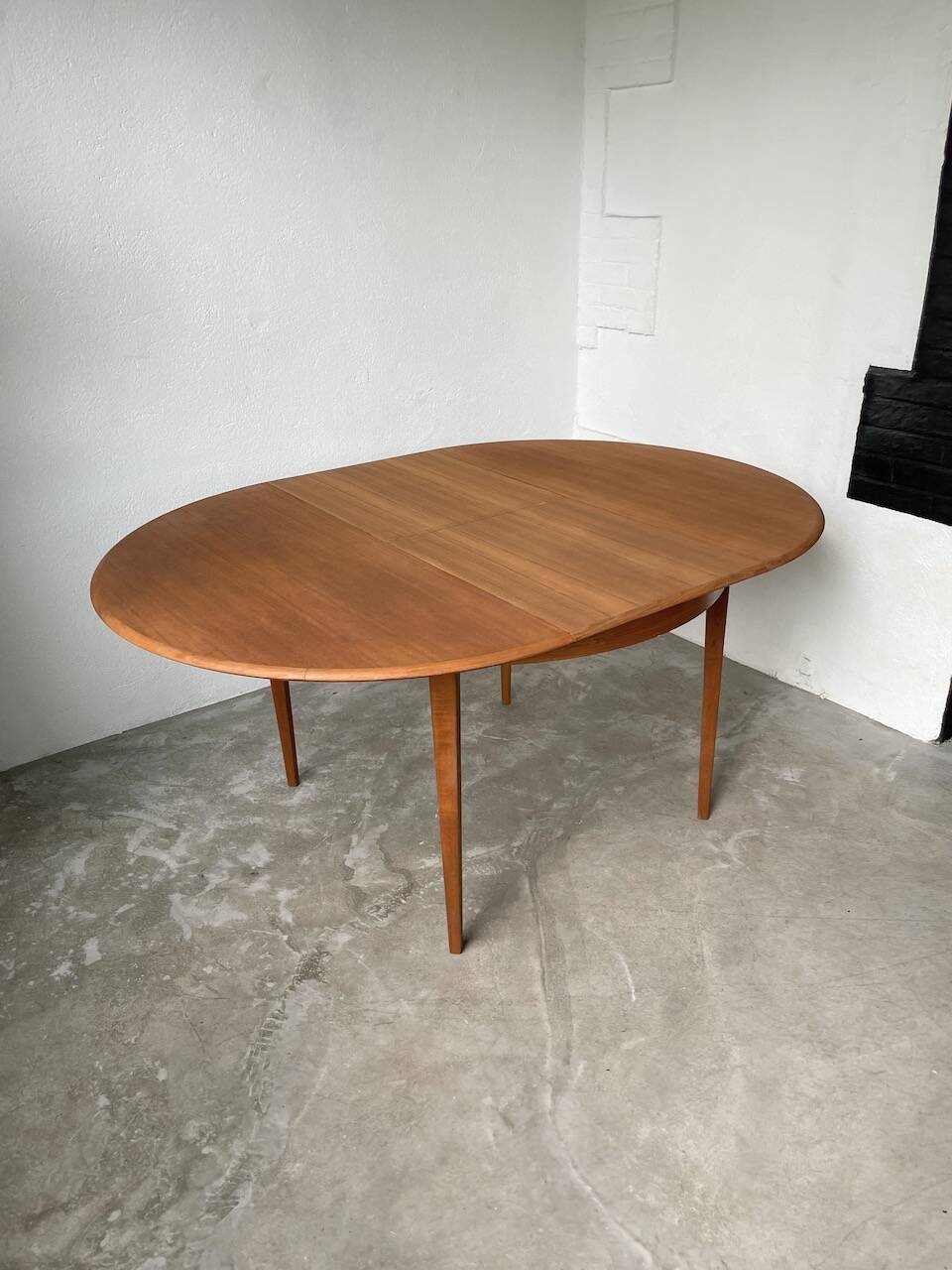 Scandinavian round teak table with extension