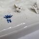 Saxon porcelain group, two fighting goats, signed Röhle, 1900
