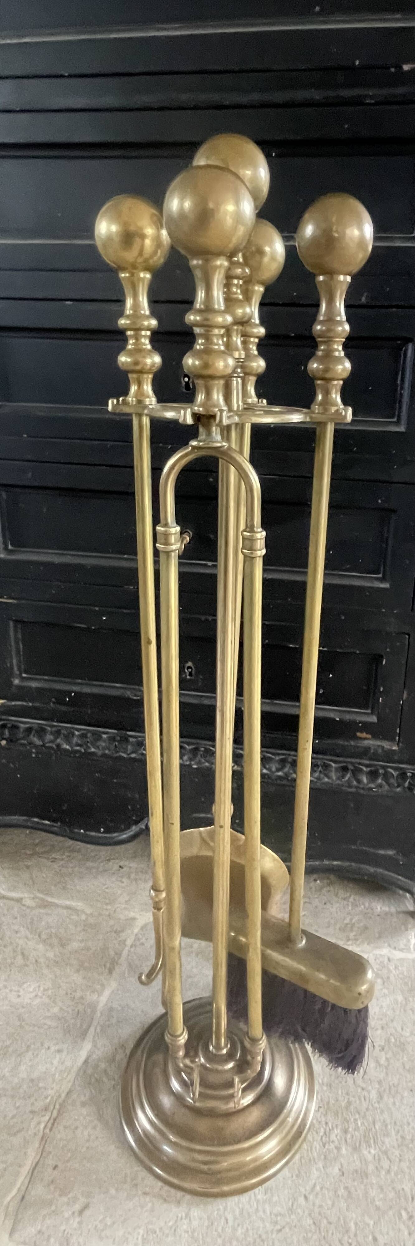 Brass fireplace accessory set with vintage stand