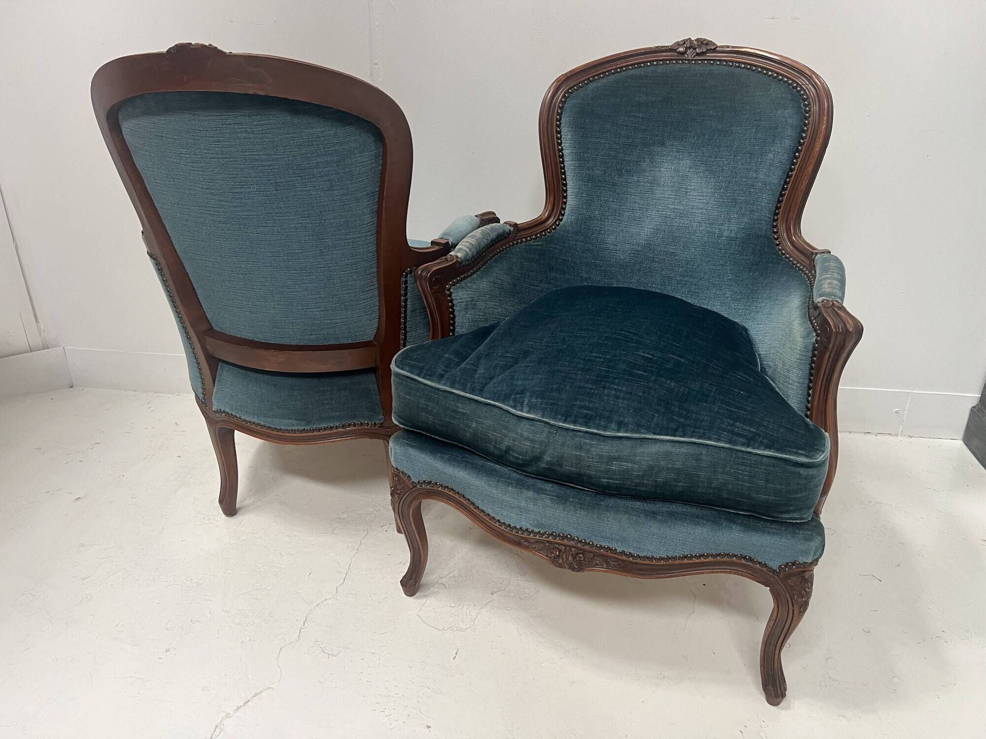 Pair of Louis XV style armchairs in natural wood, 20th century.