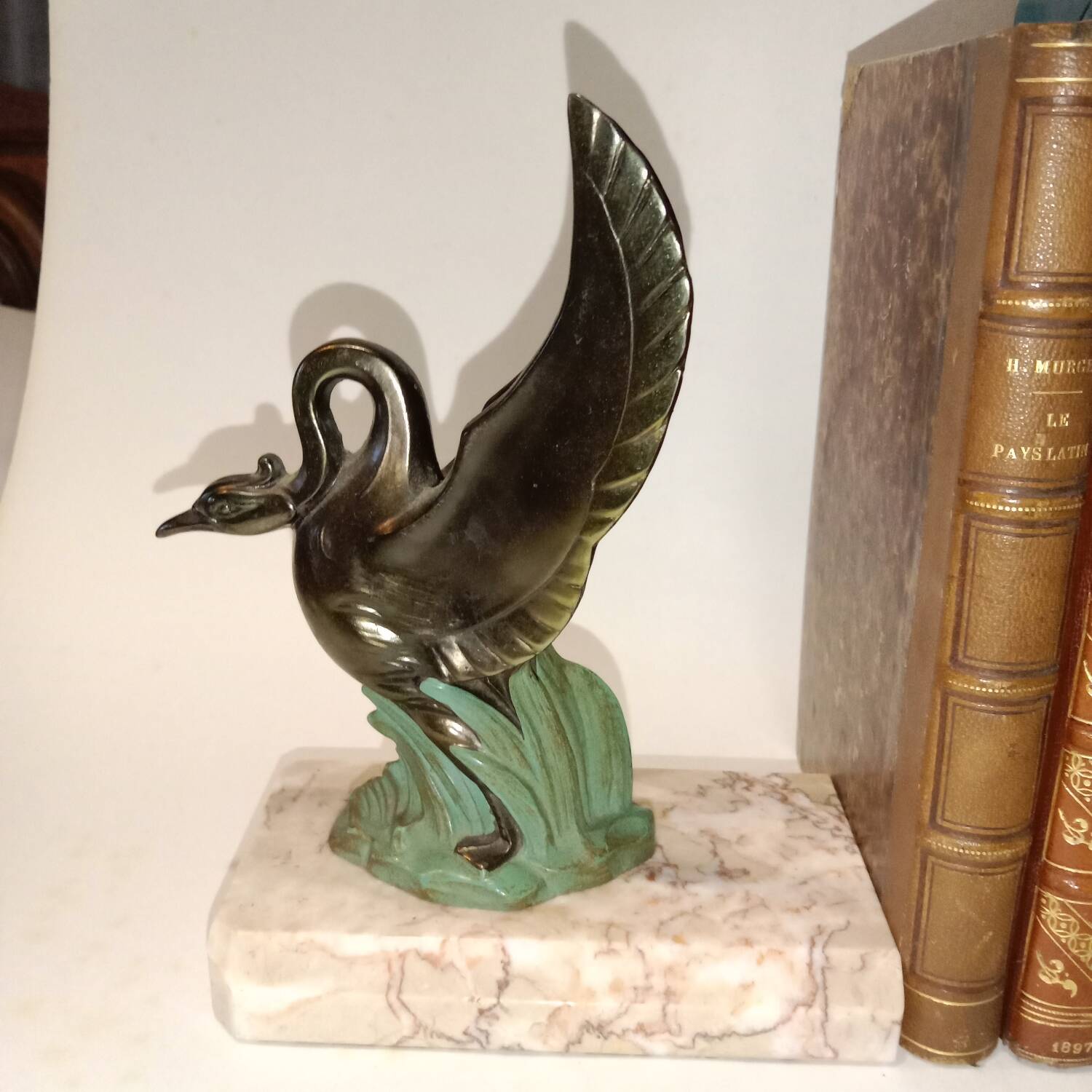 Art Deco bookends with metal swans, double patina and marble base.