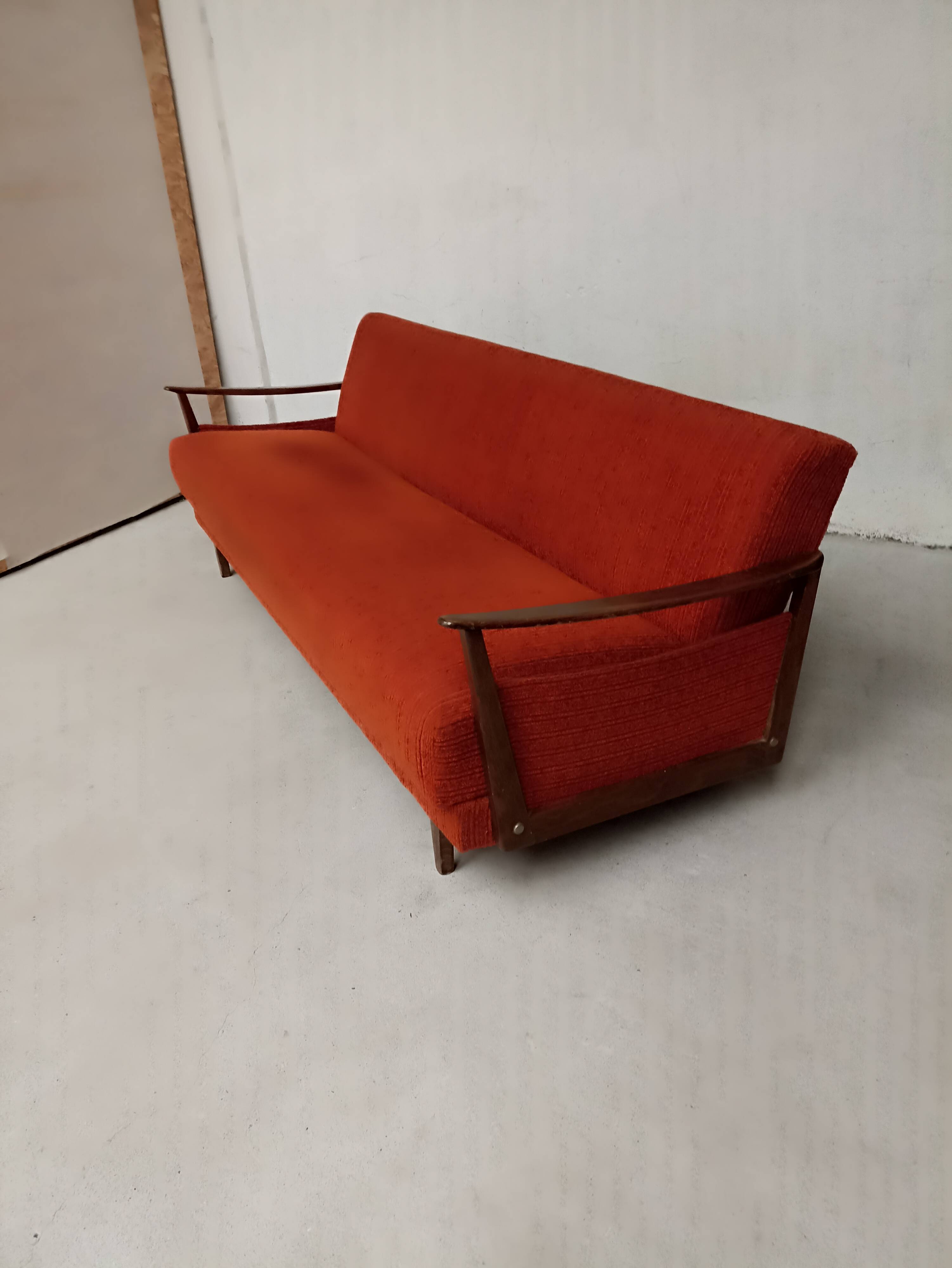 Vintage orange convertible sofa