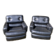 Pair of black imitation leather armchairs