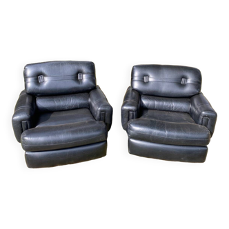 Pair of black imitation leather armchairs