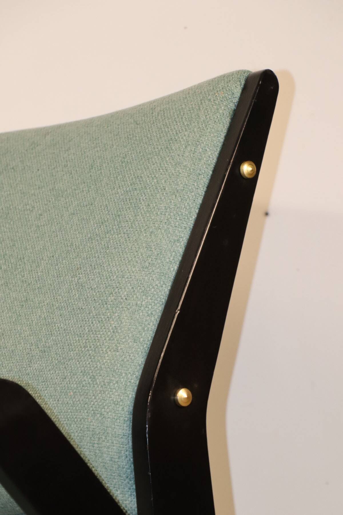 Vintage armchair from the 1960s in black wood and fabric.