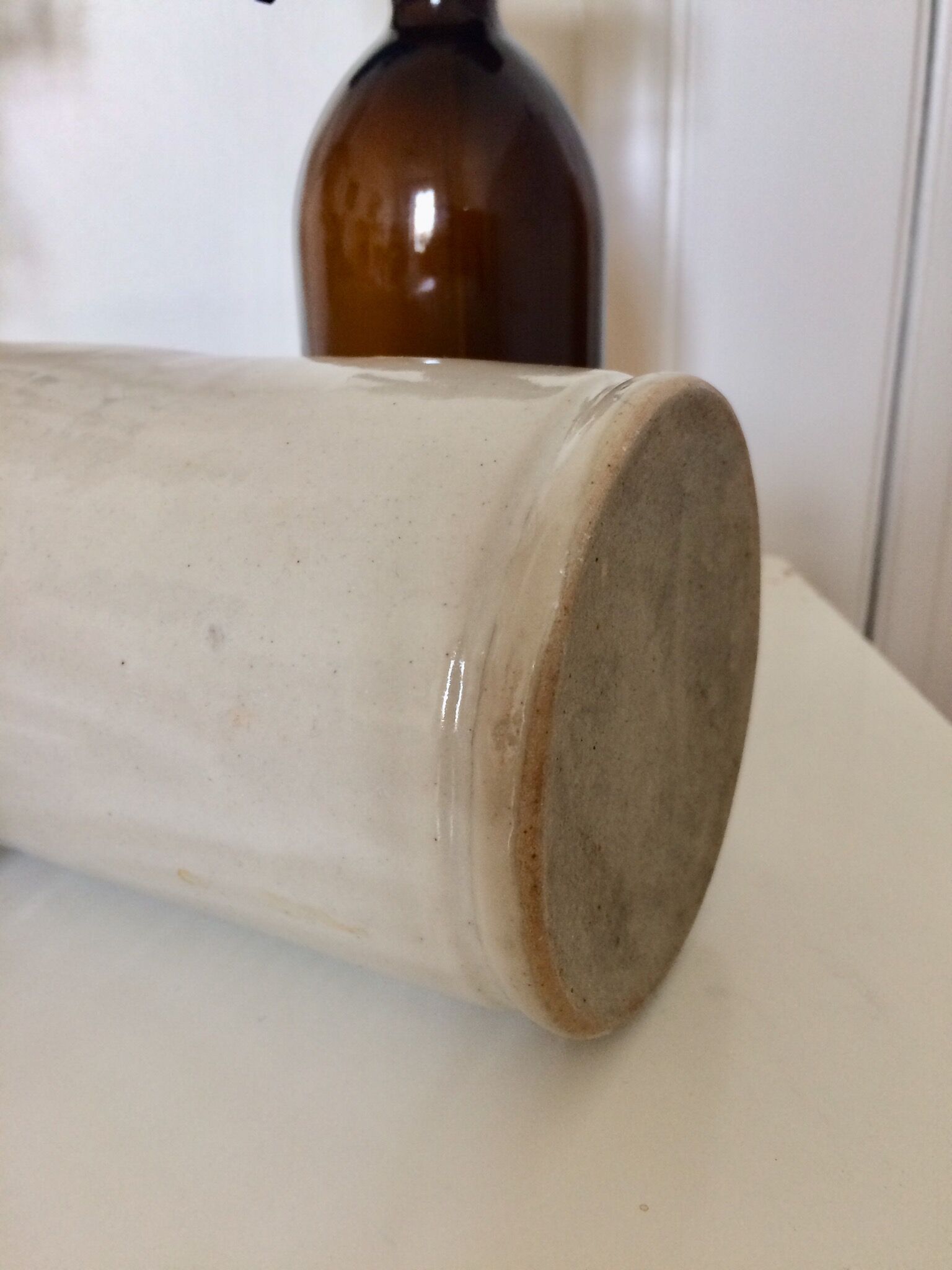 Beige varnished sandstone bottle
