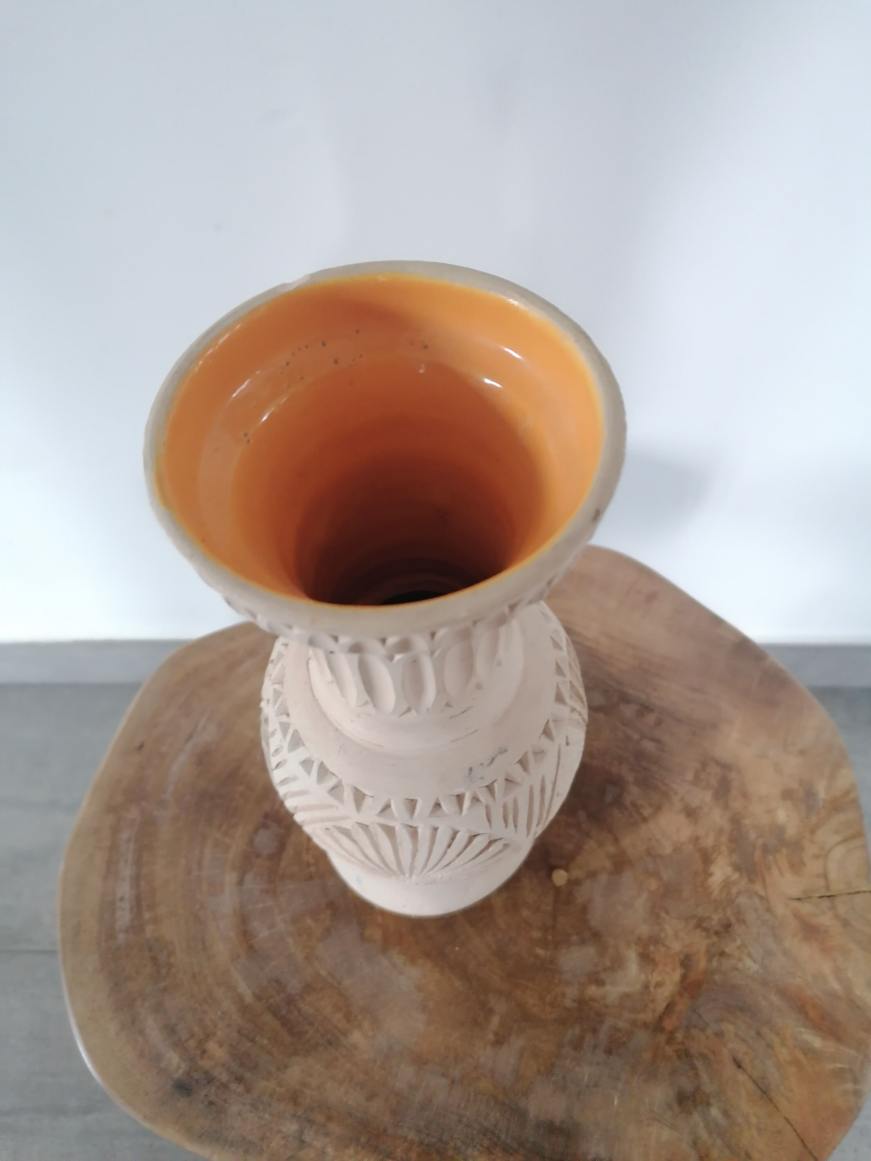 Clear natural terracotta vase decorated ethnic motifs