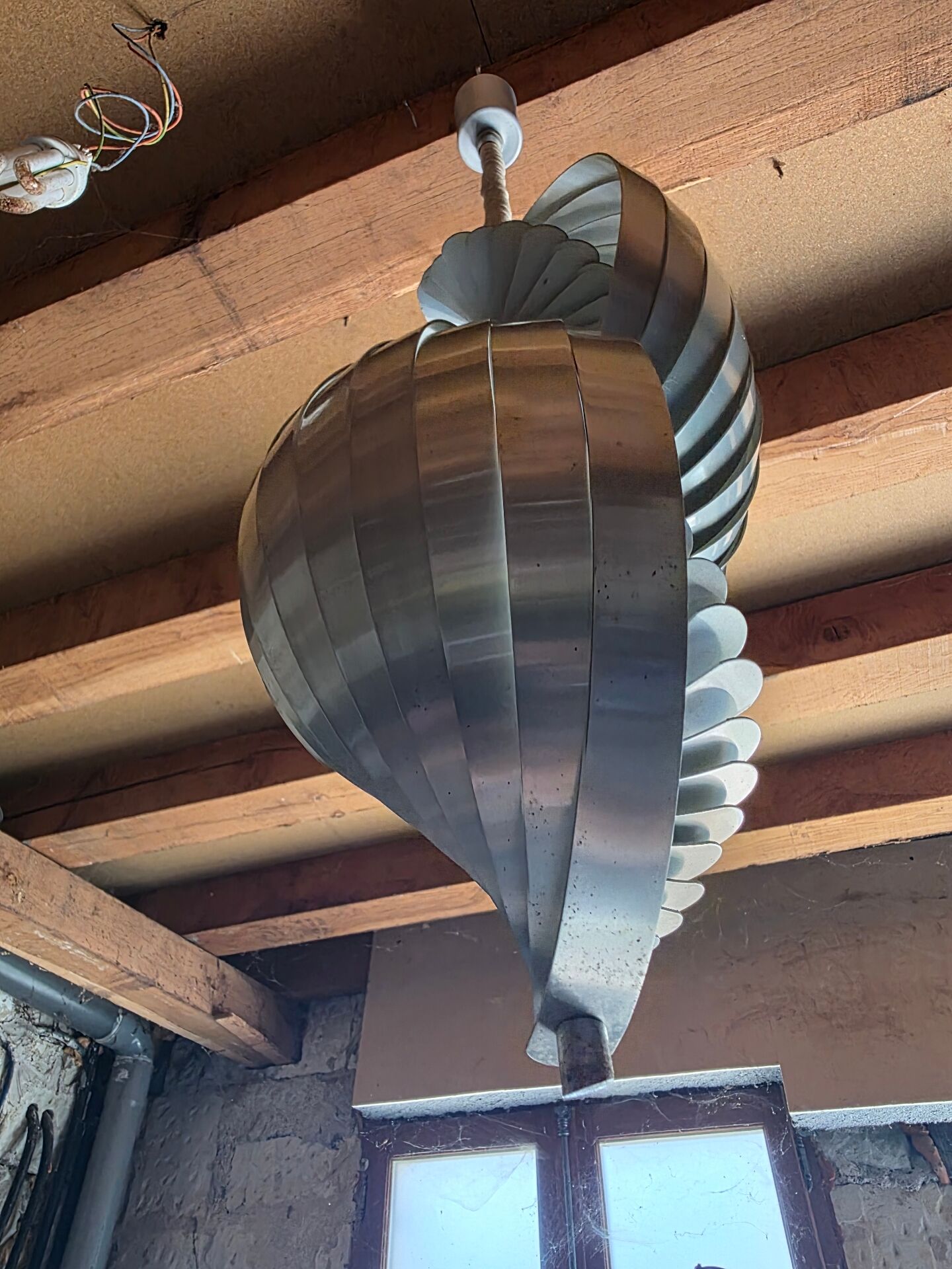 Henri Mathieu ceiling light from the 1970s in spiral aluminium.