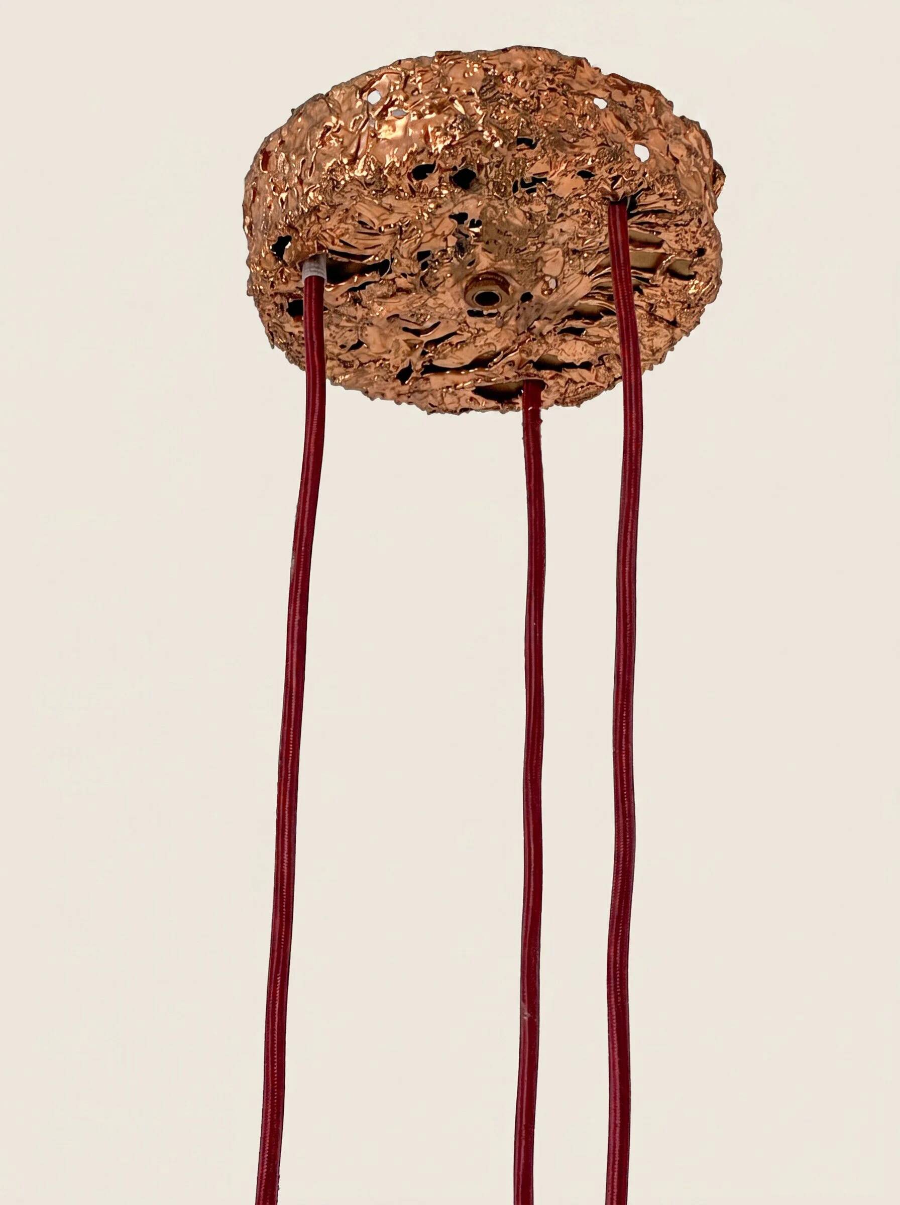 Suspension composed of 3 brutalist copper lamps by Aimo Tukiainen, 1960s.